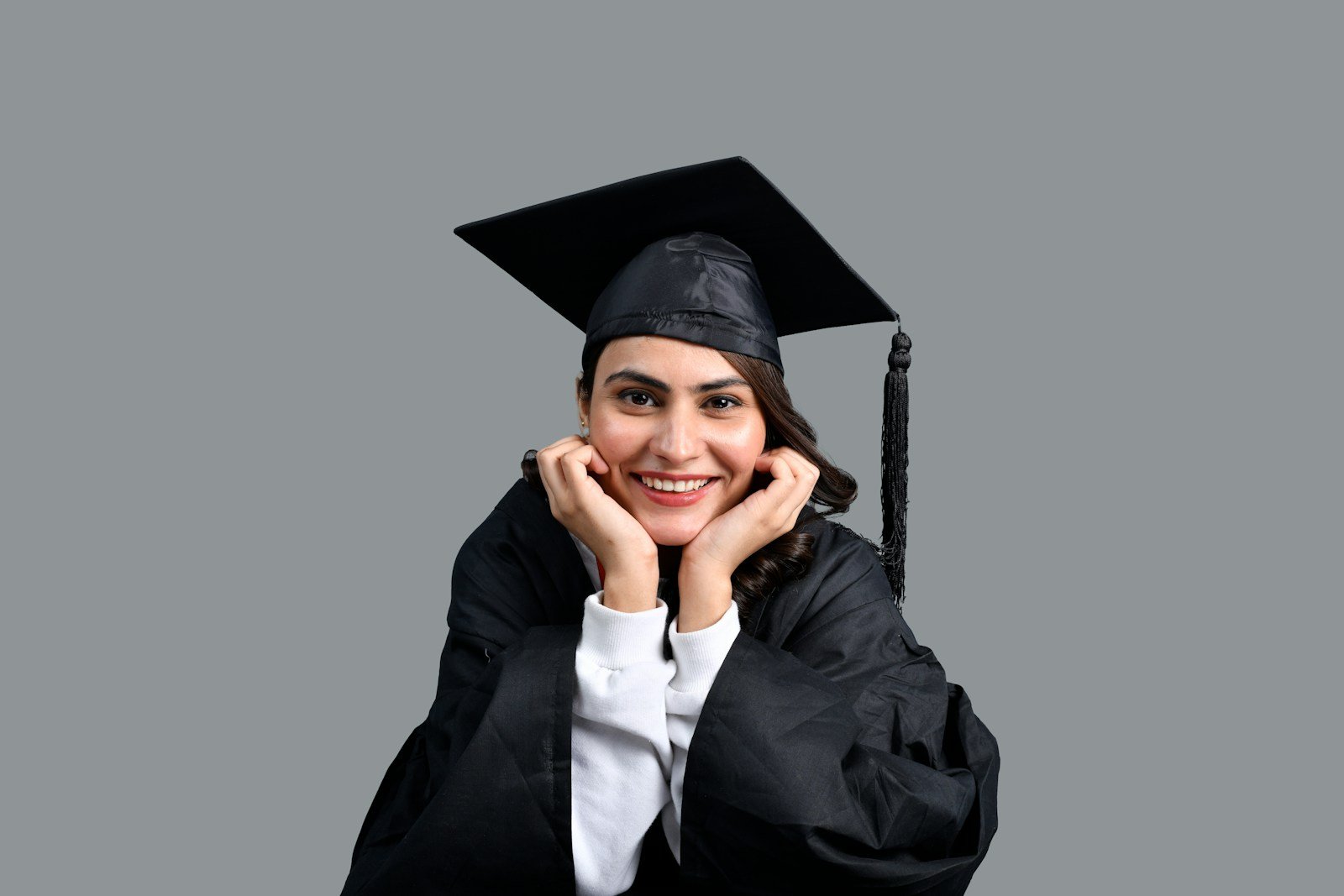 a person wearing a graduation cap and gown